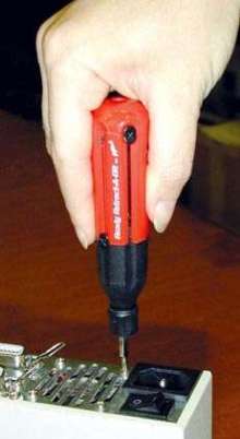 Screwdriver features retracting, self-storing bits.