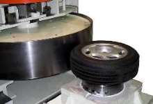 Tire Uniformity Machine measures unbalance at 2,300 rpm.