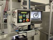 Machine marks optical center of corrective lenses.