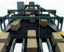 Wide Belt Conveyor features fixed belt plows.