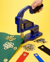 Hand Press allows flexible placement of metal grommets.