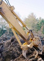 Multifunctional Stump Harvester offers one-man operation.