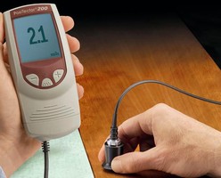 Handheld Tester measures coating thickness.