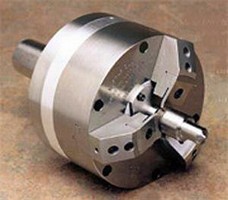 Workholding Chuck features pull down insert.