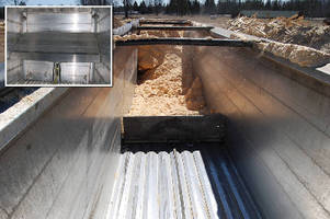 Plate helps offload non-flowing material from trailers.