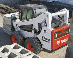 Skid-Steer Loader achieves maximum reach at full lift height.