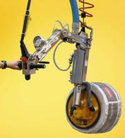 Vacuum Lifter-Tilter lifts and orients coiled products.