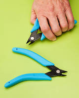 Wire Cutter features ergonomically bent handles.