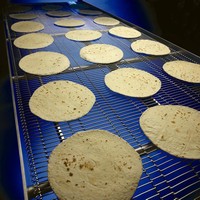 Conveyor Belt is engineered to cool tortillas.