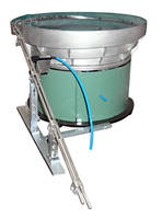 Vibratory Bowl Feeder is designed for feeding pen caps.