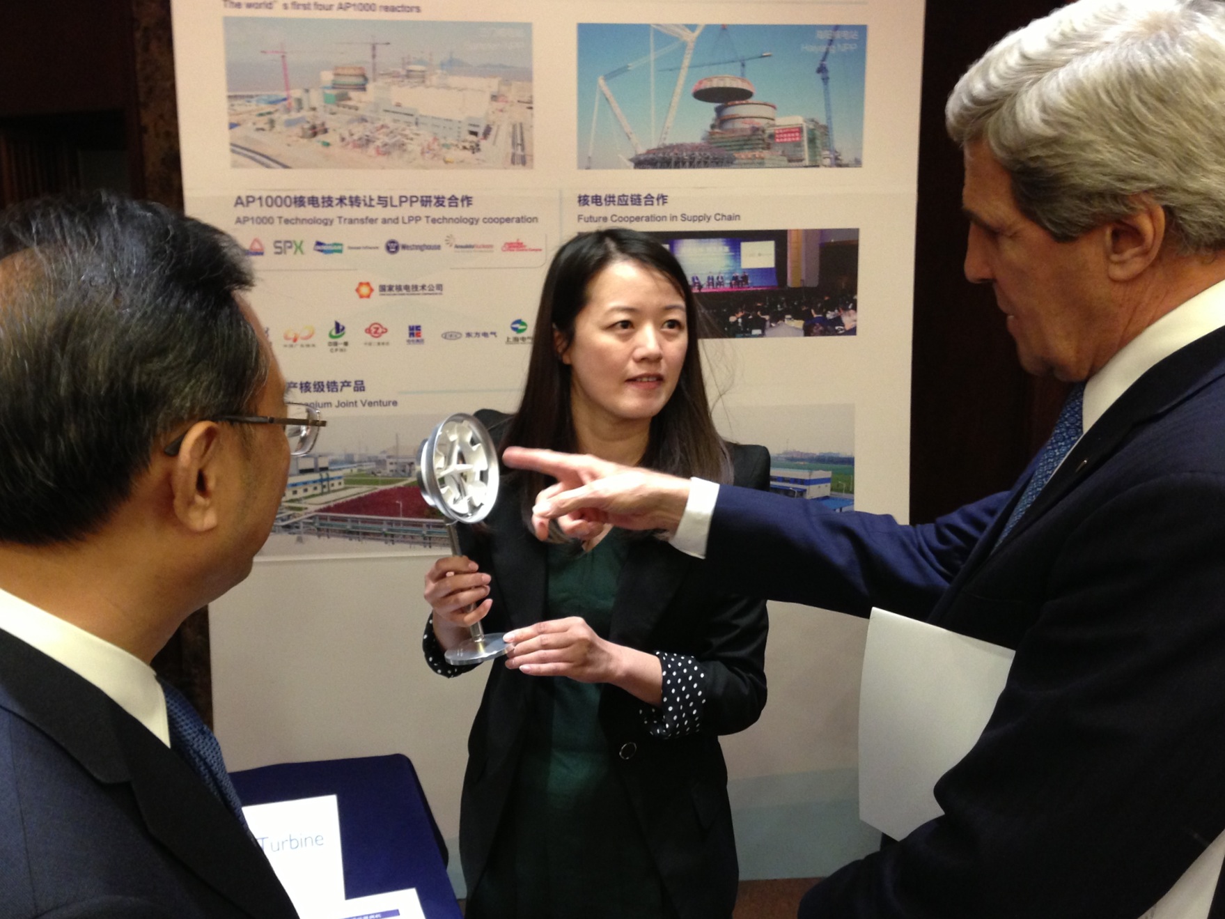 China State Councilor Yang Jiechi and U.S. Secretary of State John Kerry inspect exhibits in Beijing detailing joint U.S.-China energy projects.